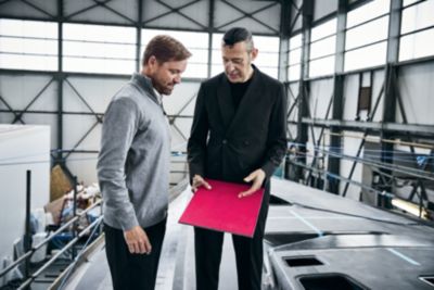 Skipper Alex Thomson and industrial designer Karim Rashid