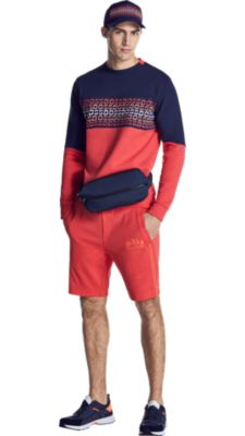 Man in sweatshirt, shorts, and sneakers by BOSS menswear