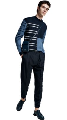 Man in blue striped sweater and blue trousers by BOSS menswear