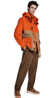 Man in orange and tan jacket and tan trousers by BOSS menswear