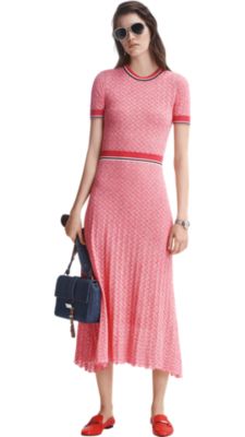 Woman wearing pink dress and orange shoes by BOSS