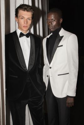  Male models wearing suits in black and white by BOSS
