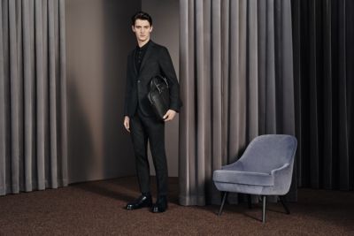 Man wearing a black suit by BOSS