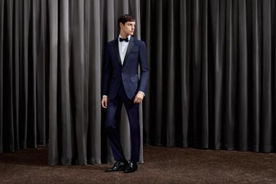 Man wearing a black tuxedo and bow by BOSS