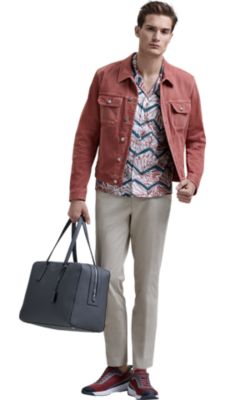 Man wearing printed shirt, salmon jacket, beige trousers and brown shoes by BOSS