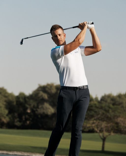Professional golf player wearing an athleisure polo shirt and trousers by BOSS