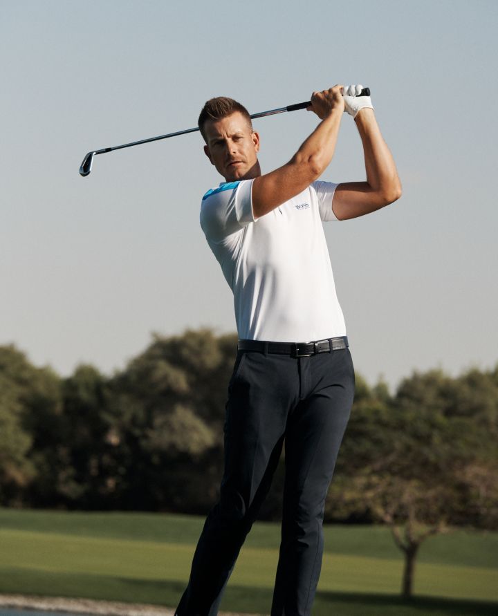 Professional golf player wearing an athleisure polo shirt and trousers by BOSS