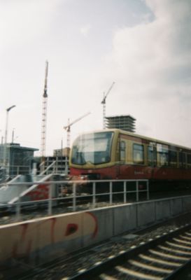 Train and tracks in the city of Berlin during day time