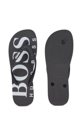 Rubber flip-flops with contrasting logo 