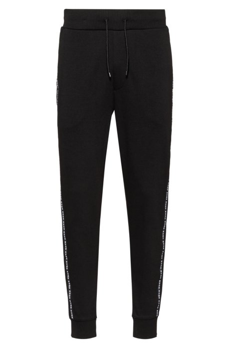 Cuffed-hem interlock-cotton trousers with logo-tape side seams, Black