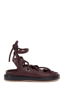 Flat leather sandals with contrast sole