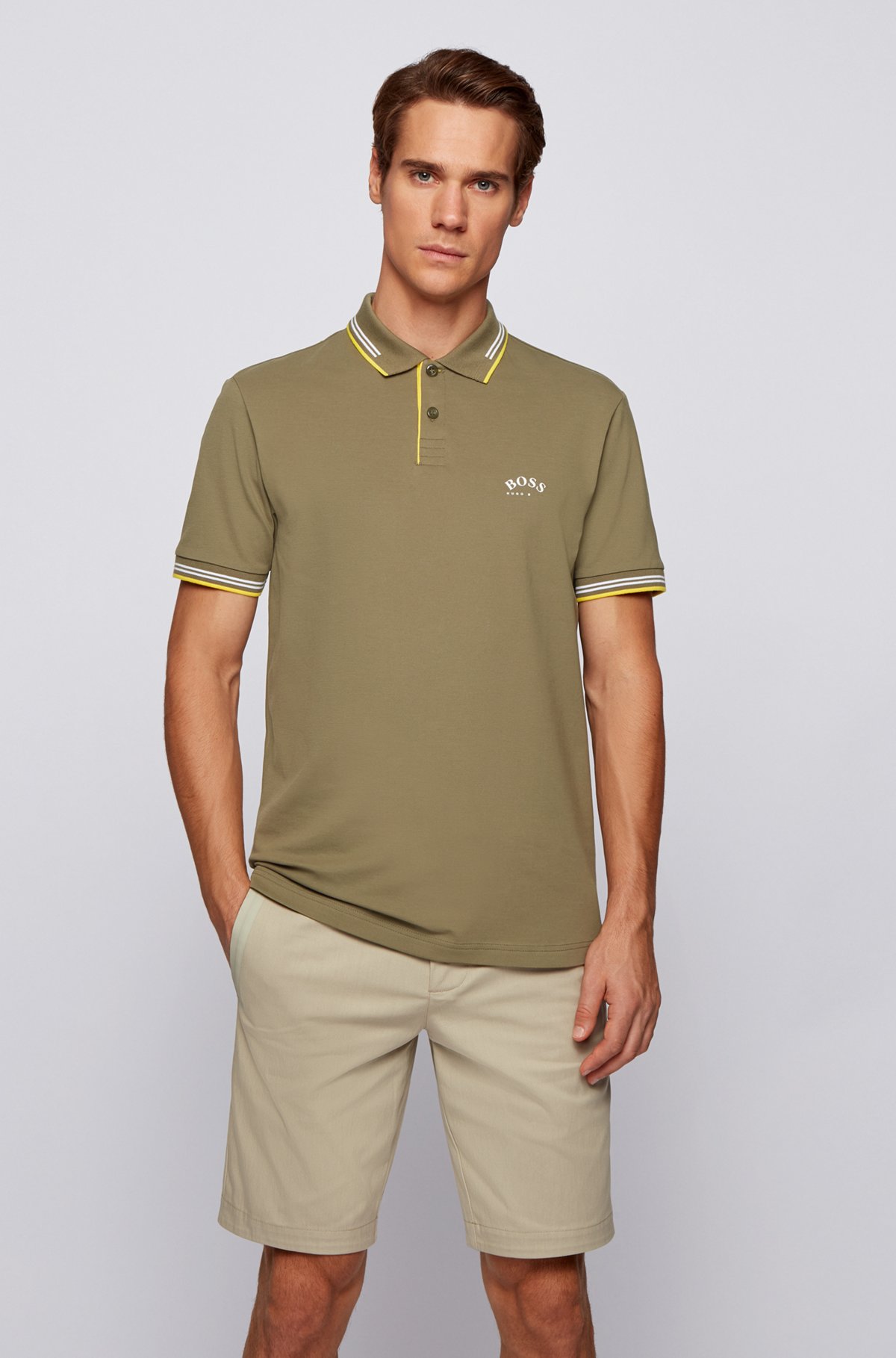 Slim-fit polo shirt in stretch piqué with curved logo, Green