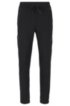 Slim-fit jogging trousers in moisture-wicking stretch fabric, Black
