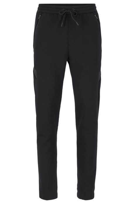 Slim-fit jogging trousers in moisture-wicking stretch fabric, Black