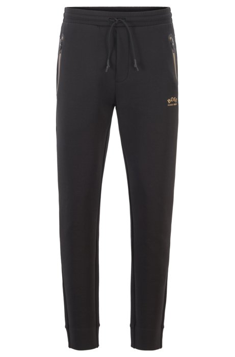 Half-cuffed jogging trousers with curved logo, Black