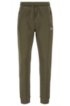 Half-cuffed jogging trousers with curved logo, Dark Green