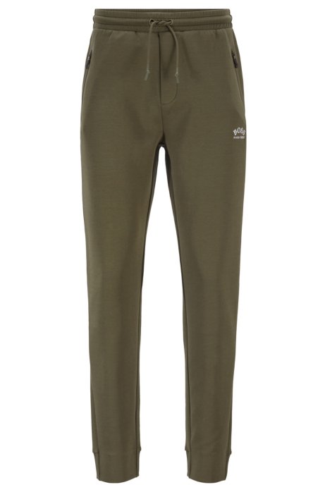 Half-cuffed jogging trousers with curved logo, Dark Green