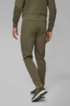 Half-cuffed jogging trousers with curved logo, Dark Green