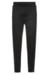 Regular-fit jogging trousers in cotton with zipped hems, Black