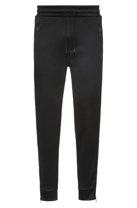 Regular-fit jogging trousers in cotton with zipped hems, Black