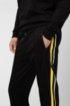 Relaxed-fit jogging trousers with printed side stripes, Black