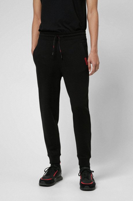 Cotton-terry tracksuit bottoms with reversed logo, Black