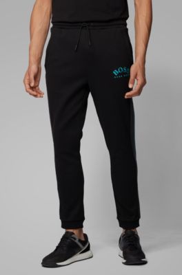 Slim-fit jogging trousers with curved logo