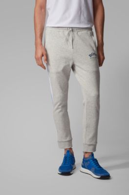 Slim-fit jogging trousers with curved logo