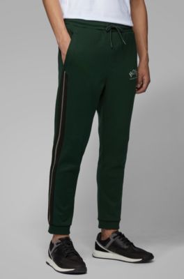 Slim-fit jogging trousers with curved logo