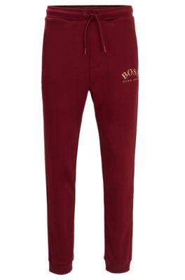 Slim-fit jogging trousers with curved logo