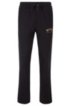 Slim-fit jogging trousers with logo and open hems, Black
