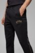 Slim-fit jogging trousers with logo and open hems, Black