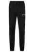 Slim-fit jogging trousers with logo and cuffed hems, Black