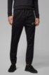 Slim-fit jogging trousers with logo and cuffed hems, Black