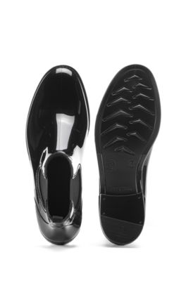 Regenstiefel aus glänzendem Gummi Regenstiefel aus glänzendem Gummi