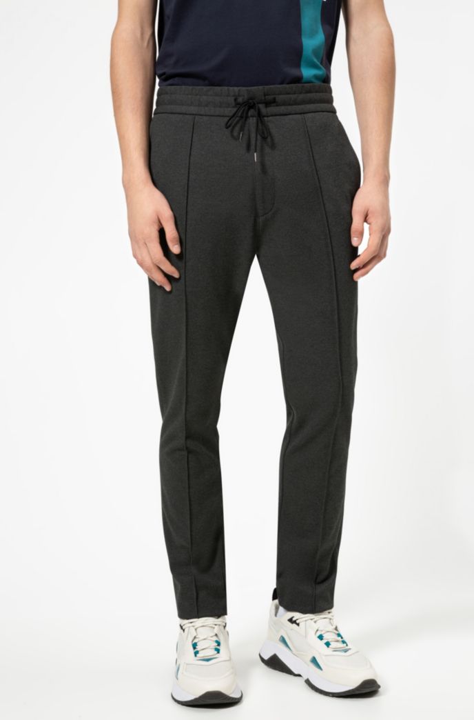 Tapered-fit trousers in jersey twill with drawcord