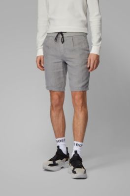 BOSS - Tapered-fit shorts in pure linen 