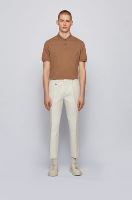 white polo and brown pants