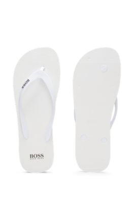 white hugo boss flip flops