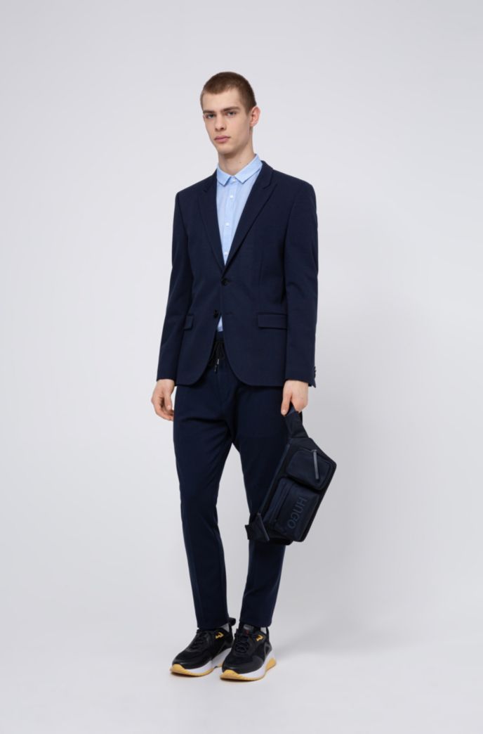 Tapered-fit trousers in pinstripe jersey with drawcord