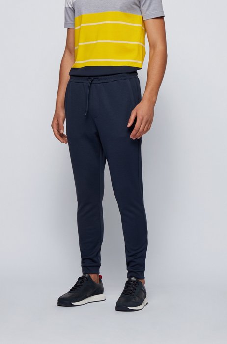 Double-faced cotton-blend tracksuit bottoms with curved logo, Dark Blue