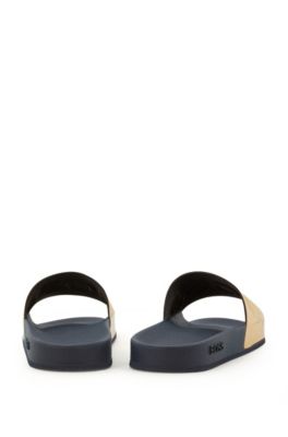 black and gold hugo boss sliders