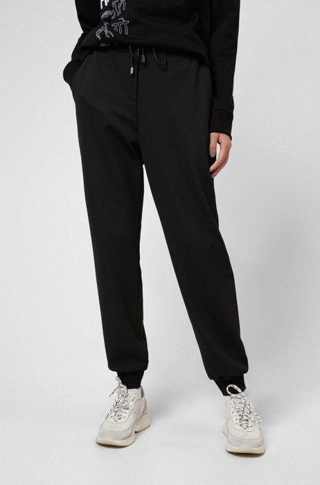 Stretch-fabric tracksuit bottoms with logo cuffs, Black