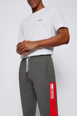 syndrome eel Night BOSS - Cuffed-hem tracksuit bottoms with colour-block logo