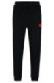 Jogginghose aus Baumwolle mit rotem Logo-Patch, Schwarz