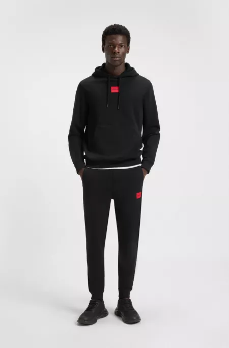Cotton-terry tracksuit bottoms with red logo label