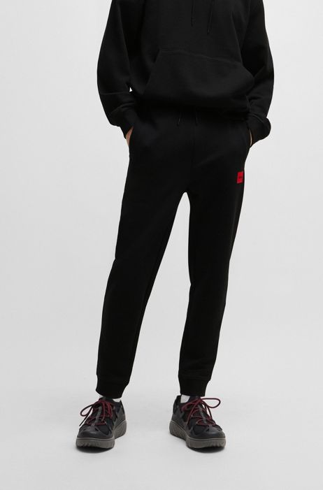 Herren Bekleidung Sport- HUGO Baumwolle Jogginghose aus Baumwoll-Mix mit gerahmtem Logo in Schwarz für Herren und Fitnesskleidung Jogginghosen Training 