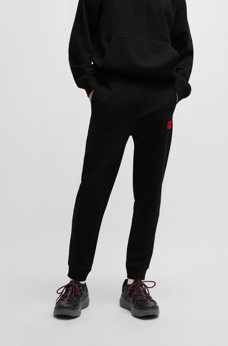 Pantaloni della tuta in cotone con toppa con logo rossa, Nero