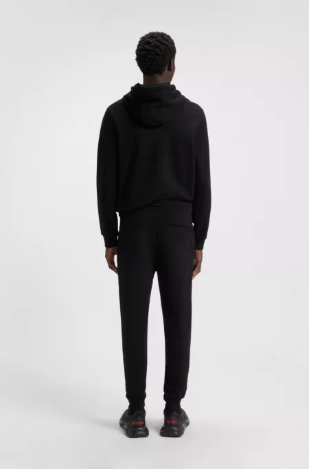 Cotton-terry tracksuit bottoms with red logo label
