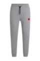 Cotton tracksuit bottoms with red logo patch, Dark Grey